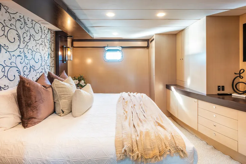 Texas T Yacht Photos Pics Luxurious bedroom interior on 2009 Sulis Marine Expedition Yacht with elegant decor and soft lighting.