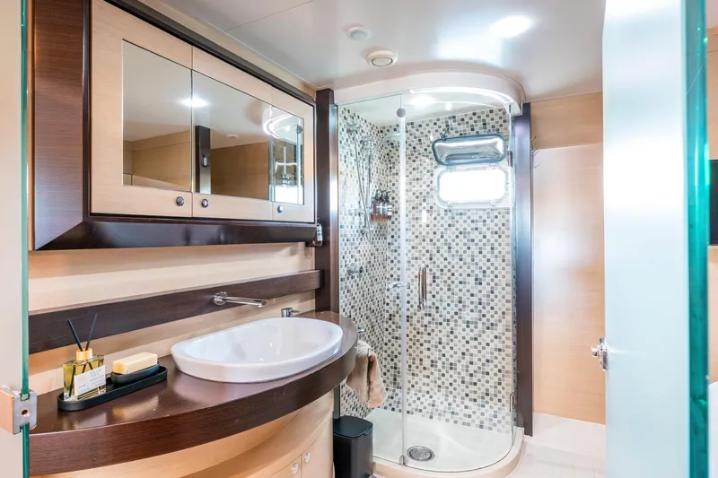 Texas T Yacht Photos Pics Luxurious bathroom on 2009 Custom Sulis Marine Expedition Yacht with modern shower and elegant fixtures.