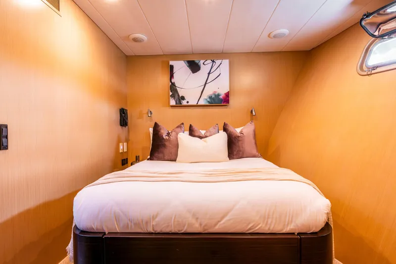 Texas T Yacht Photos Pics Luxurious bedroom on 2009 Sulis Marine Expedition Yacht with modern decor and cozy bedding.