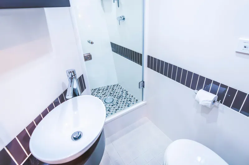 Texas T Yacht Photos Pics Modern bathroom on 2009 Sulis Marine Expedition Yacht with sleek sink and shower.