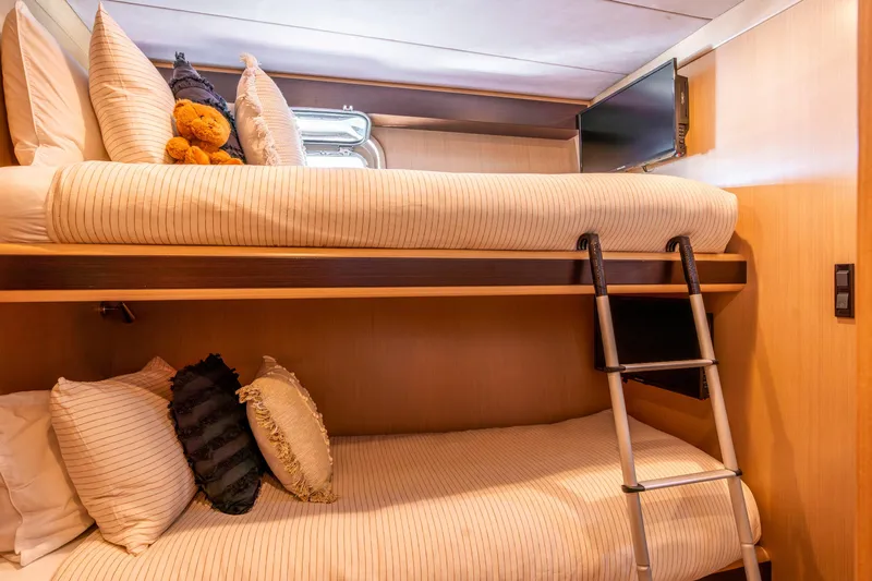 Texas T Yacht Photos Pics Bunk beds in 2009 Sulis Marine Expedition Yacht cabin with cozy pillows and ladder.