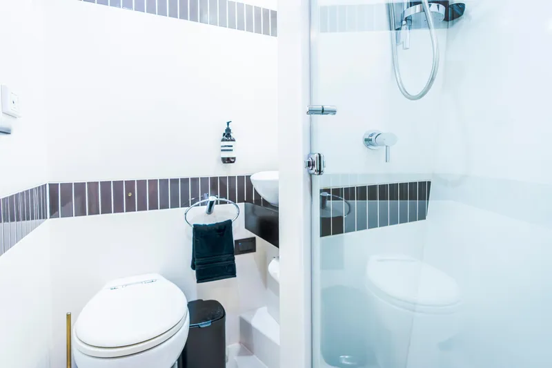 Texas T Yacht Photos Pics Luxurious bathroom on 2009 Sulis Marine Expedition Yacht with modern shower and toilet.