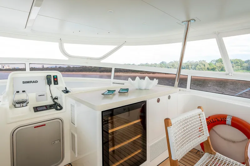 Texas T Yacht Photos Pics Luxurious interior of 2009 Custom Sulis Marine Expedition Yacht with navigation equipment and scenic view.