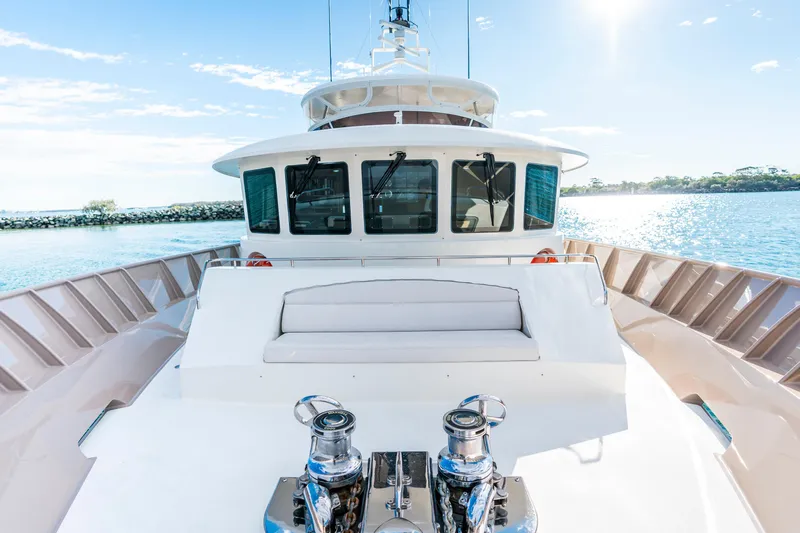 Texas T Yacht Photos Pics Custom 2009 Sulis Marine Expedition Yacht on sunny waters, featuring spacious deck and modern design.