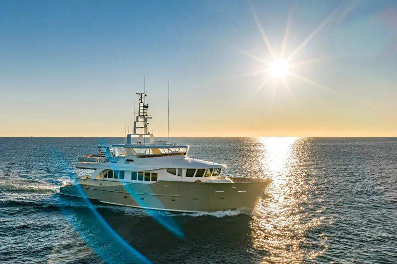 Texas T Yacht Photos Pics Custom 2009 Sulis Marine Expedition Yacht cruising at sunset on open sea.