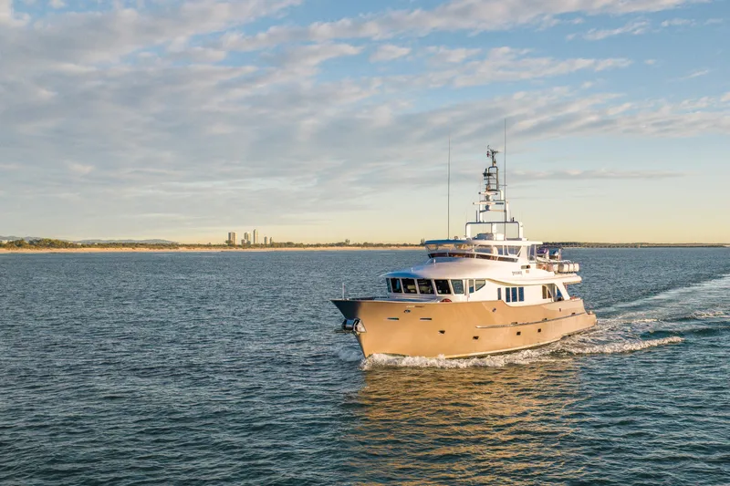 Texas T Yacht Photos Pics Custom 2009 Sulis Marine Expedition Yacht cruising on open water under a clear sky.