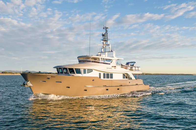 Texas T Yacht Photos Pics Custom 2009 Sulis Marine Expedition Yacht cruising on open water under a blue sky.