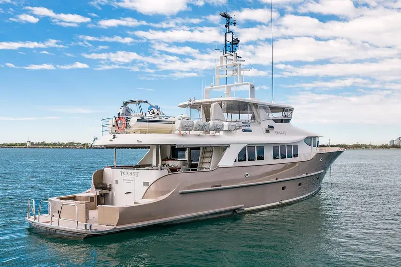 Texas T Yacht Photos Pics Custom 2009 Sulis Marine Expedition Yacht on calm waters under a blue sky.