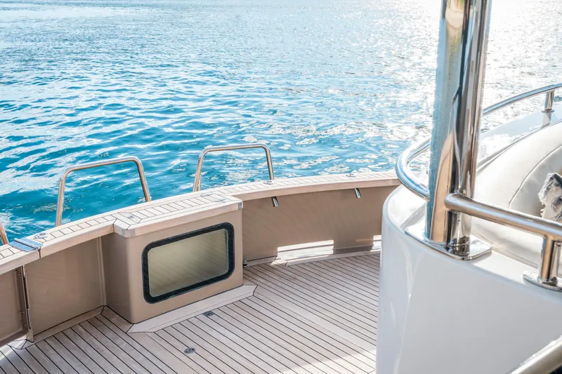 Texas T Yacht Photos Pics Luxurious deck of 2009 Sulis Marine Expedition Yacht on serene blue waters.