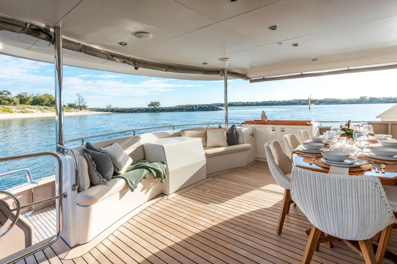 Texas T Yacht Photos Pics Luxurious 2009 Sulis Marine Expedition Yacht with elegant outdoor dining and seating area.