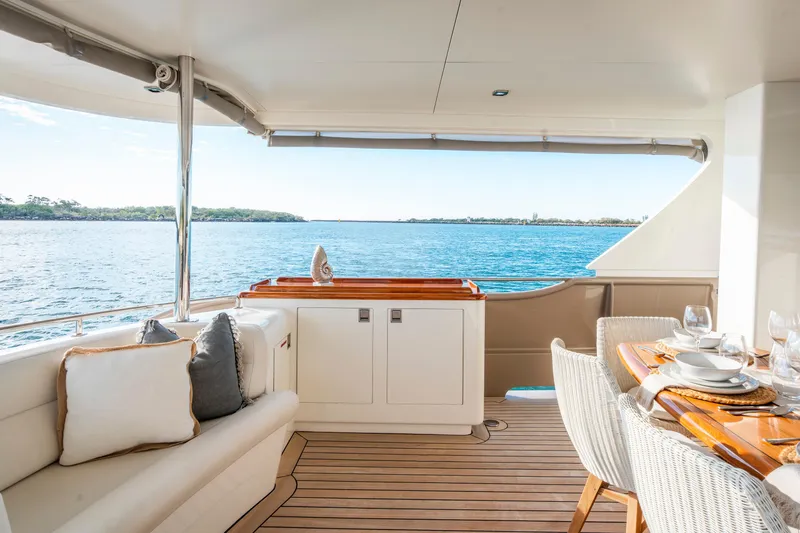 Texas T Yacht Photos Pics Luxurious 2009 Sulis Marine Expedition Yacht deck with elegant dining setup and ocean view.