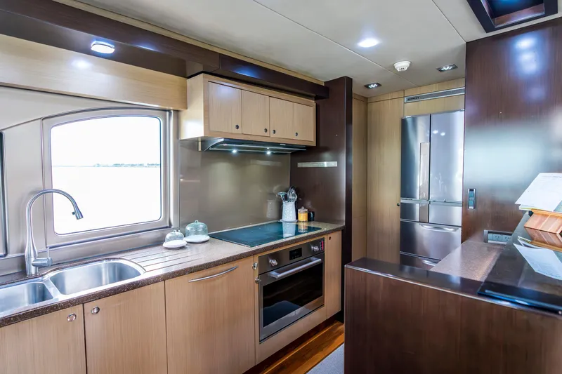 Texas T Yacht Photos Pics Luxurious kitchen interior of 2009 Custom Sulis Marine Expedition Yacht with modern appliances.