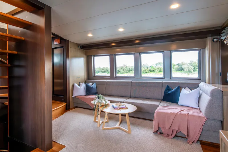 Texas T Yacht Photos Pics Luxurious interior of 2009 Custom Sulis Marine Expedition Yacht with cozy seating and large windows.