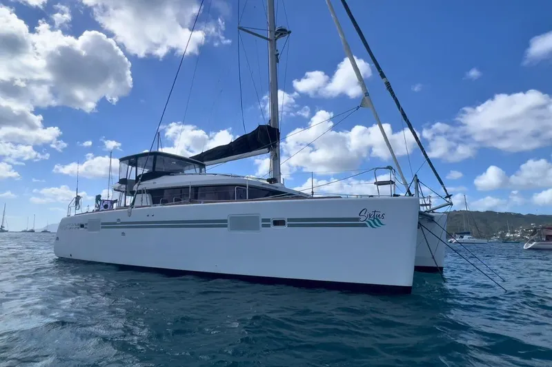 Sixtus Yacht Photos Pics 2016 Lagoon 450 S catamaran sailing on a sunny day with blue skies.