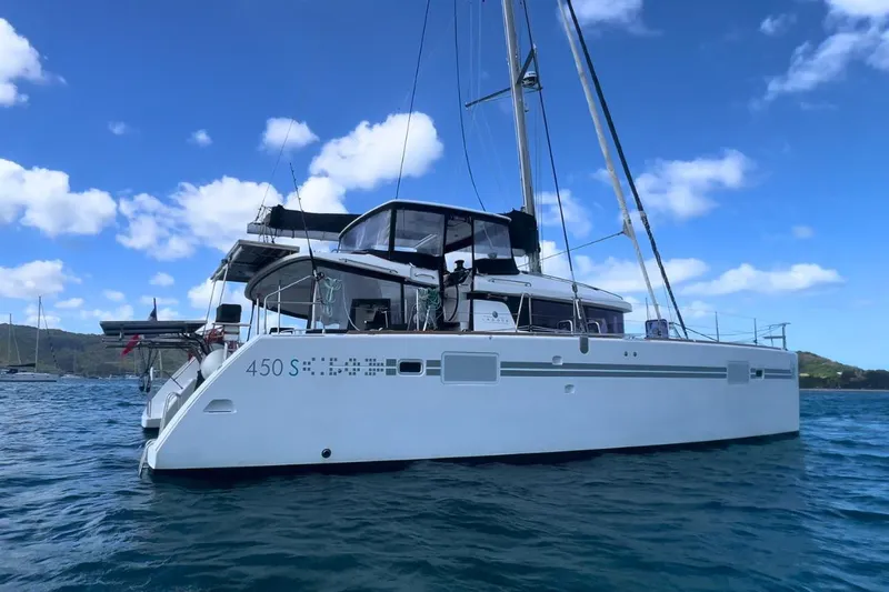 Sixtus Yacht Photos Pics 2016 Lagoon 450 S catamaran sailing on blue ocean under clear sky.