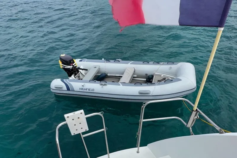 Sixtus Yacht Photos Pics Inflatable boat near Lagoon 450 s yacht, 2016, with a flag in the background.