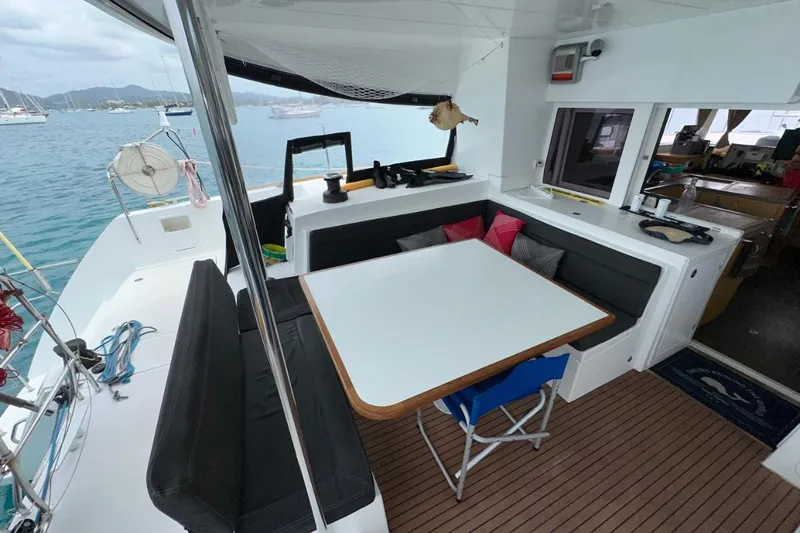 Sixtus Yacht Photos Pics 2016 Lagoon 450 S catamaran with outdoor seating, table, and ocean view.