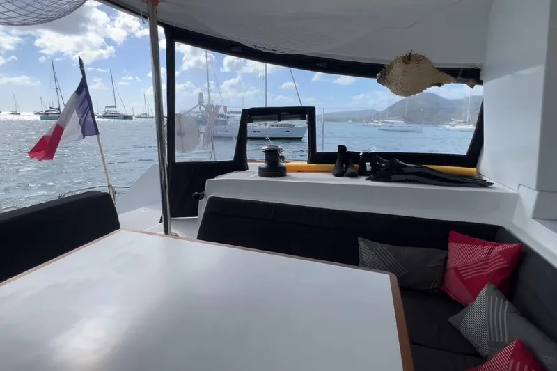 Sixtus Yacht Photos Pics Interior view of 2016 Lagoon 450 S catamaran with scenic marina backdrop.