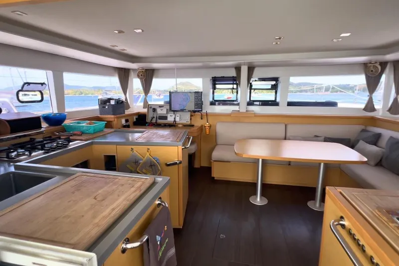 Sixtus Yacht Photos Pics Interior of 2016 Lagoon 450 S catamaran with modern kitchen and dining area.