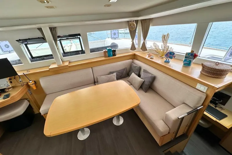 Sixtus Yacht Photos Pics Interior of 2016 Lagoon 450 s catamaran with cozy seating and ocean view.