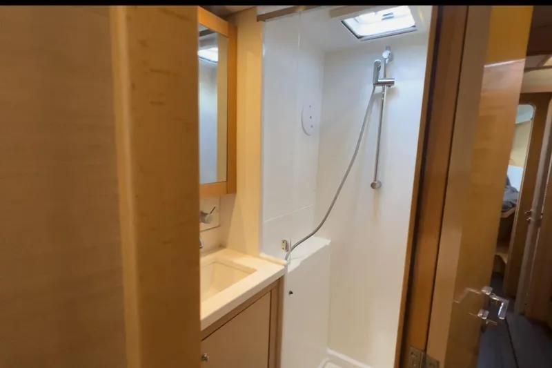 Sixtus Yacht Photos Pics Compact bathroom in 2016 Lagoon 450 s yacht with shower and sink.