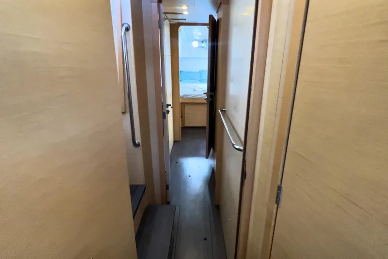 Sixtus Yacht Photos Pics Interior hallway of 2016 Lagoon 450 S catamaran with wooden finish.