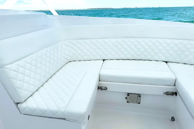  Yacht Photos Pics Luxurious white seating on 2024 Intrepid 41 Valor boat, overlooking the ocean.