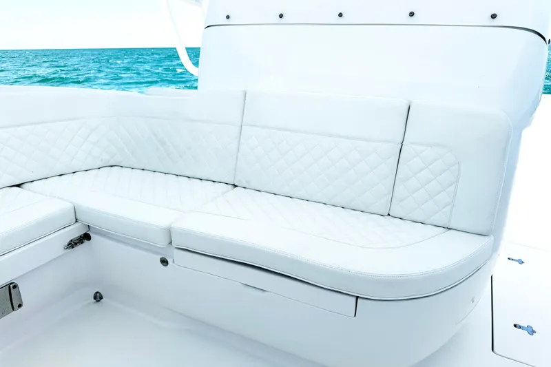  Yacht Photos Pics Luxurious white seating on 2024 Intrepid 41 Valor boat with ocean backdrop.