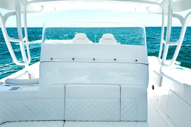  Yacht Photos Pics 2024 Intrepid 41 Valor yacht interior with ocean view, featuring luxurious white seating.