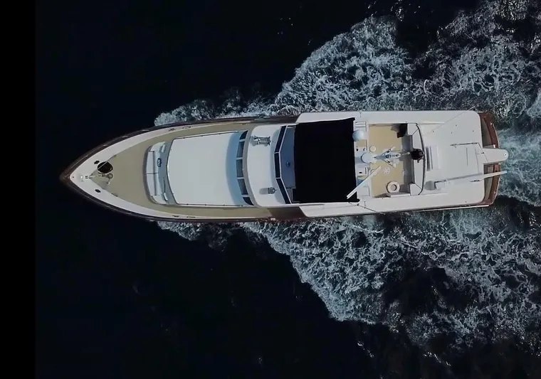 Sweet Freedom Yacht Photos Pics Aerial view of a 1984 Broward CPMY yacht on the water.