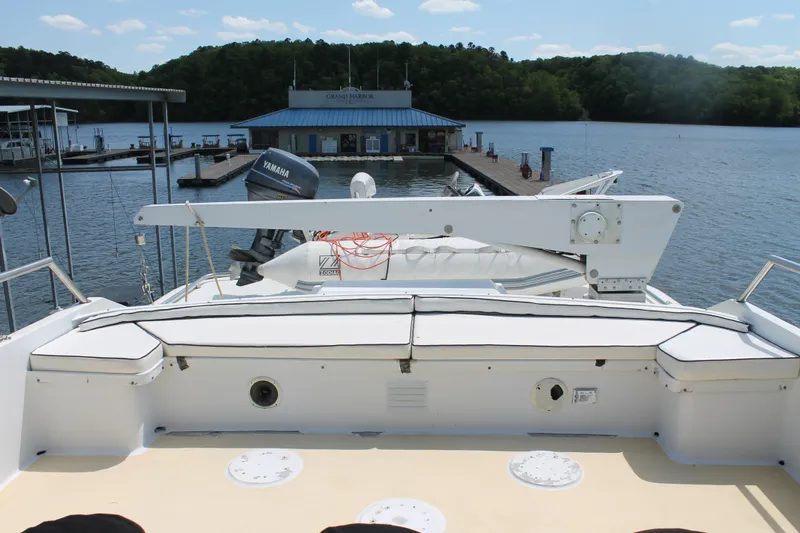 Sweet Freedom Yacht Photos Pics 1984 Broward CPMY yacht docked with scenic water view.