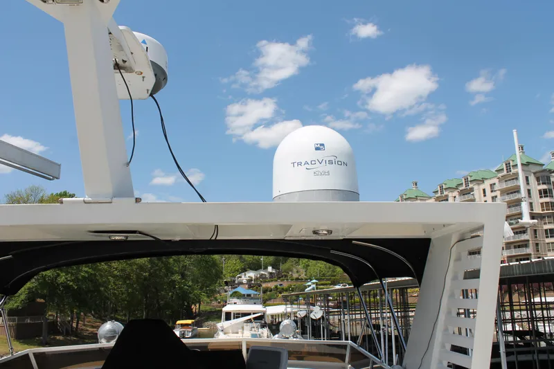 Sweet Freedom Yacht Photos Pics 1984 Broward CPMY with satellite dish in marina.