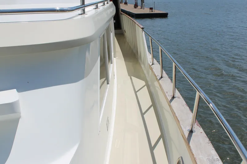 Sweet Freedom Yacht Photos Pics Broward CPMY Raised Pilothouse 1984 at dock, side view.