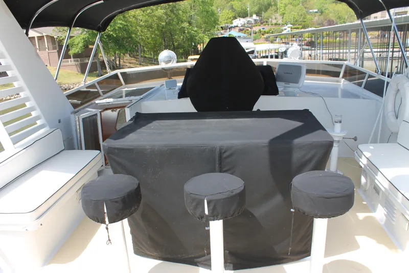 Sweet Freedom Yacht Photos Pics 1984 Broward CPMY yacht with raised pilothouse, outdoor seating area.