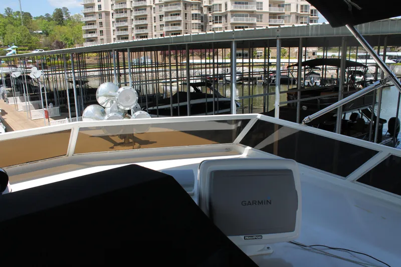 Sweet Freedom Yacht Photos Pics 1984 Broward CPMY yacht with Garmin navigation system in marina.