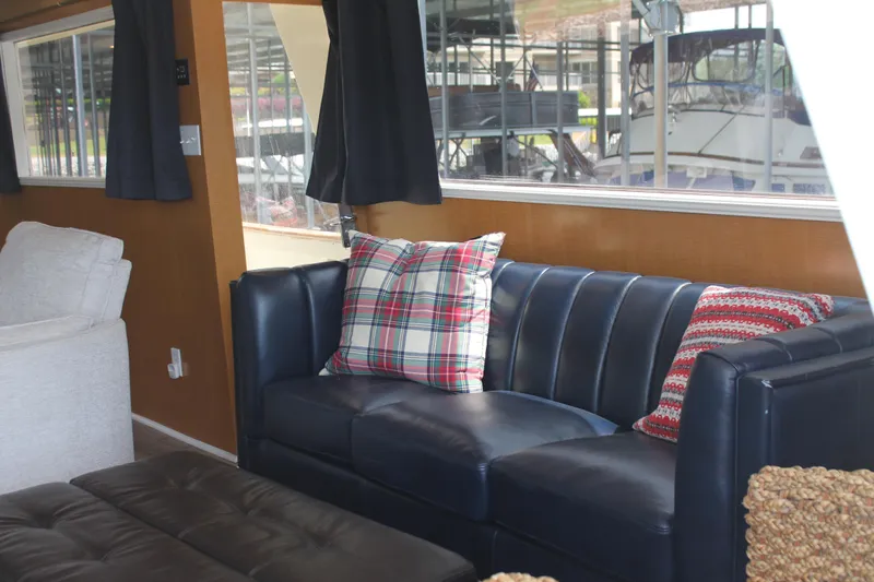 Sweet Freedom Yacht Photos Pics Interior of 1984 Broward CPMY yacht with leather sofa and cushions.