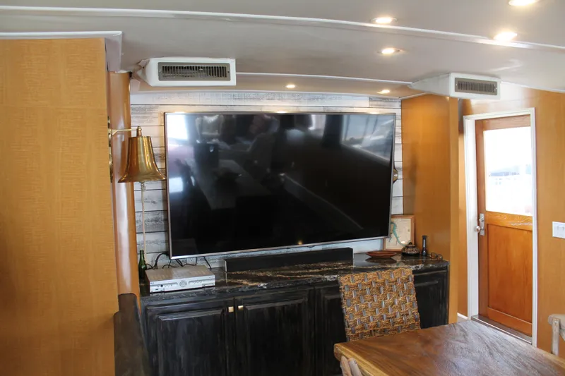 Sweet Freedom Yacht Photos Pics Interior of 1984 Broward CPMY with large TV.