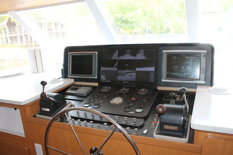 Sweet Freedom Yacht Photos Pics 1984 Broward CPMY helm with navigation instruments.