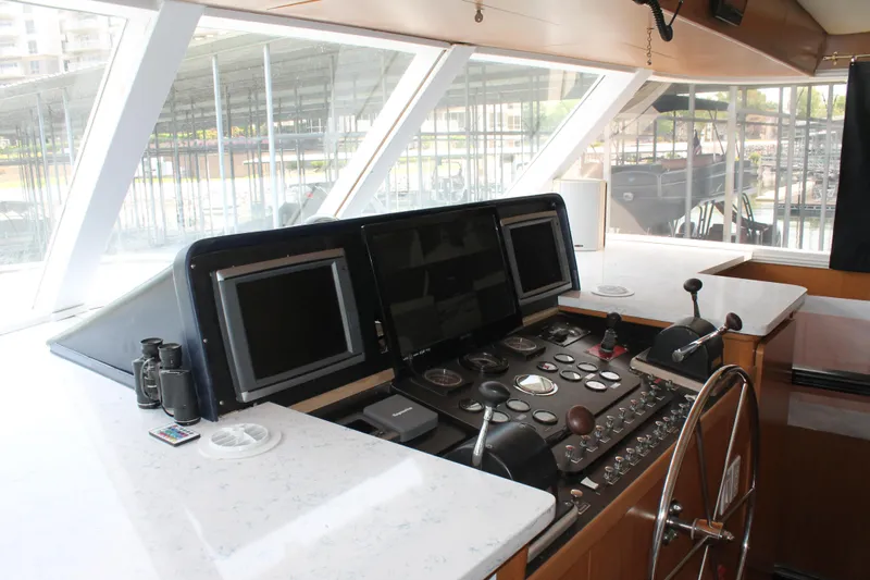 Sweet Freedom Yacht Photos Pics 1984 Broward CPMY helm with modern navigation equipment.