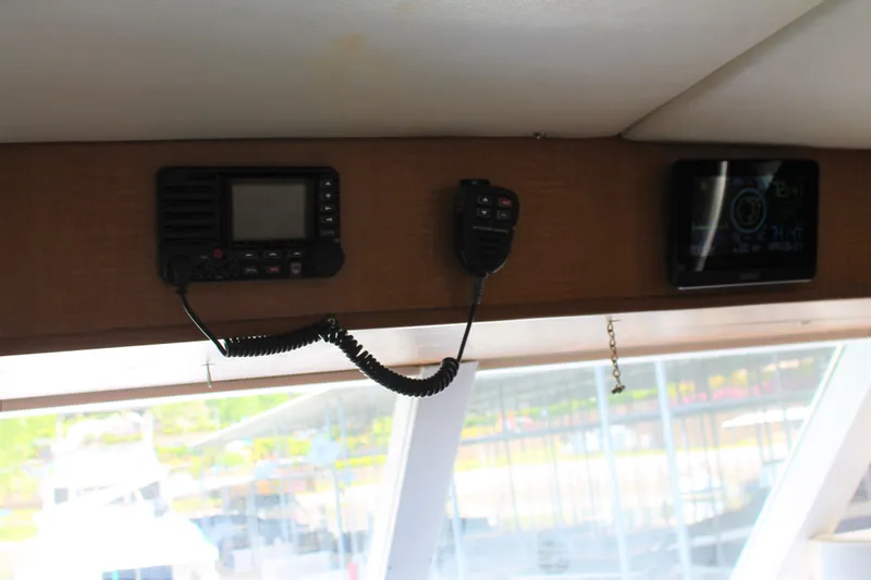 Sweet Freedom Yacht Photos Pics Interior view of 1984 Broward CPMY with radio and controls.