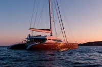 Luxury catamaran sailing at sunset, Custom Compositeworks 2006 model.