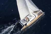 Aerial view of a 2006 Custom Compositeworks sailing yacht navigating the ocean.