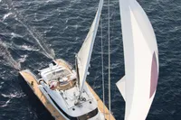 Aerial view of 2006 Custom Compositeworks yacht sailing on open water.