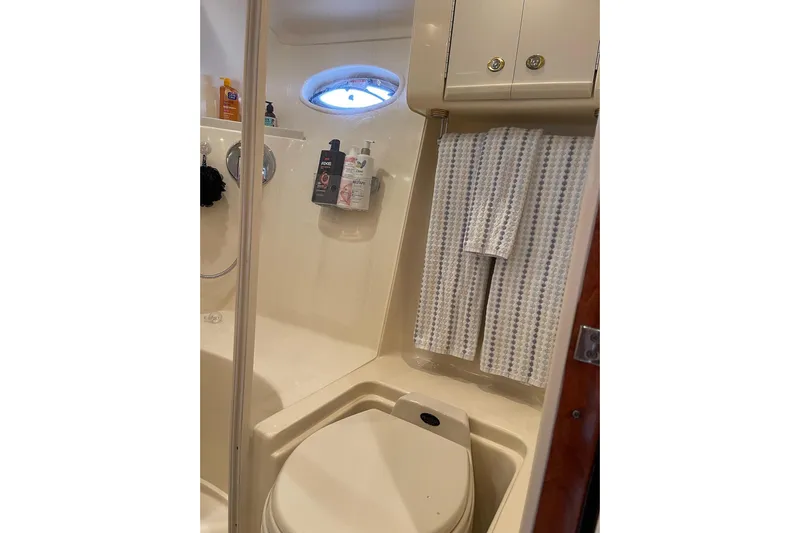  Yacht Photos Pics Bathroom interior of 2003 Sea Ray 550 Sundancer yacht, featuring shower and toilet.