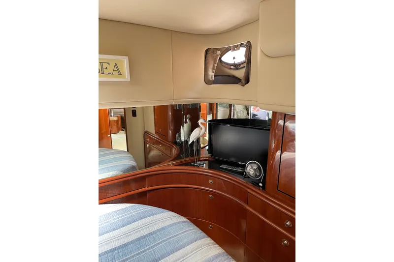  Yacht Photos Pics Luxurious interior of 2003 Sea Ray 550 Sundancer yacht with TV and elegant decor.
