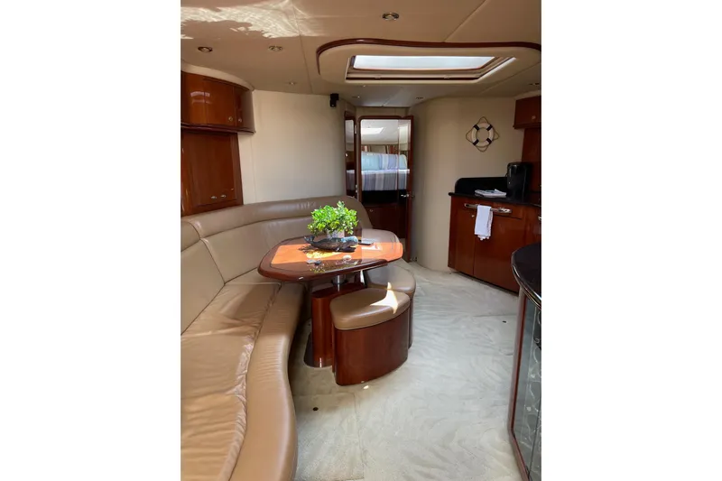  Yacht Photos Pics Luxurious interior of 2003 Sea Ray 550 Sundancer yacht with elegant seating and decor.