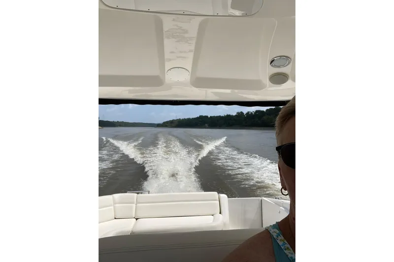  Yacht Photos Pics 2003 Sea Ray 550 Sundancer cruising on a river, view from the deck.