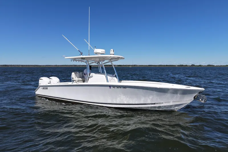  Yacht Photos Pics 2014 Jupiter 30 FS boat on open water under clear blue sky.