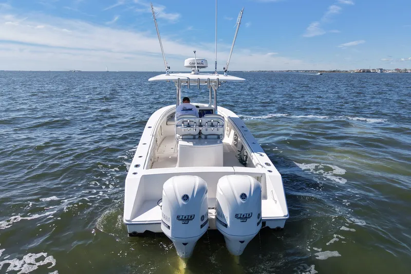  Yacht Photos Pics 2014 Jupiter 30 FS boat cruising on open water with twin Yamaha engines.