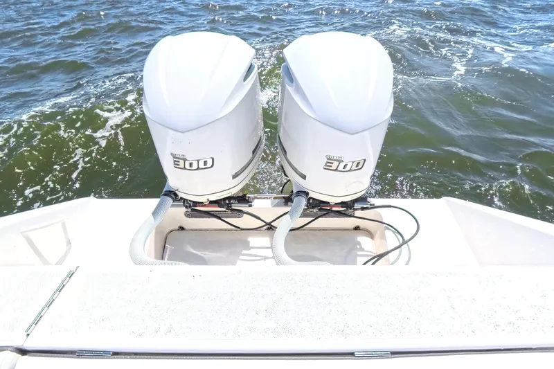  Yacht Photos Pics Twin Yamaha 300 engines on a 2014 Jupiter 30 FS boat in open water.